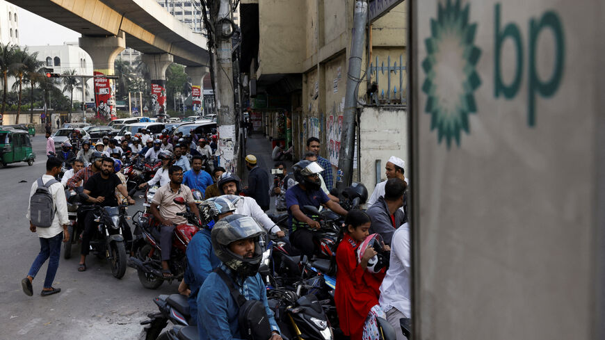 FILE PHOTO: Vehicles queue at a fuel station, as concerns grow over fuel supplies following U.S.-Israel conflict with Iran, in Dhaka, Bangladesh, March 6, 2026. REUTERS/Mohammad Ponir Hossain/File Photo