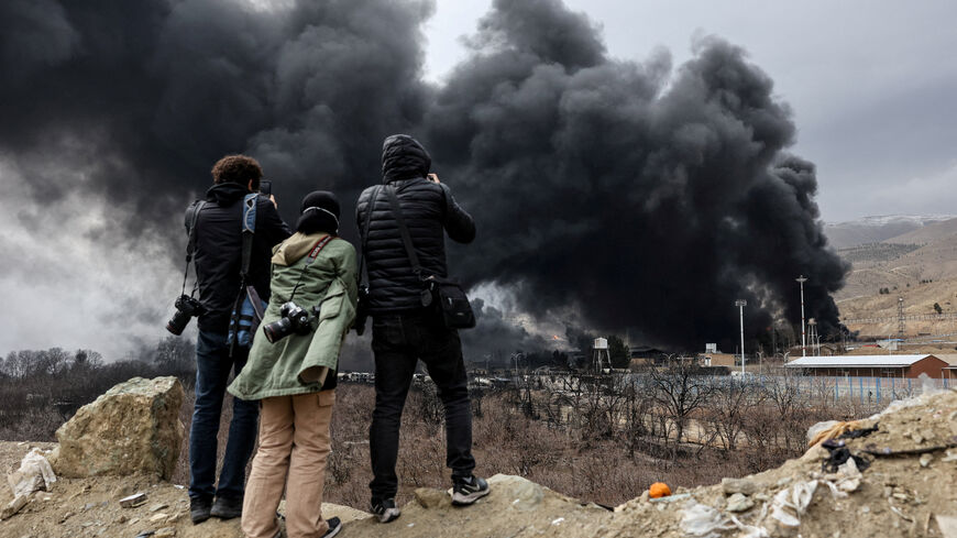 People record smoke rising after a reported strike on Shahran fuel tanks, amid the U.S.-Israeli conflict with Iran, in Tehran, Iran, March 8, 2026. Majid Asgaripour/WANA (West Asia News Agency) via REUTERS