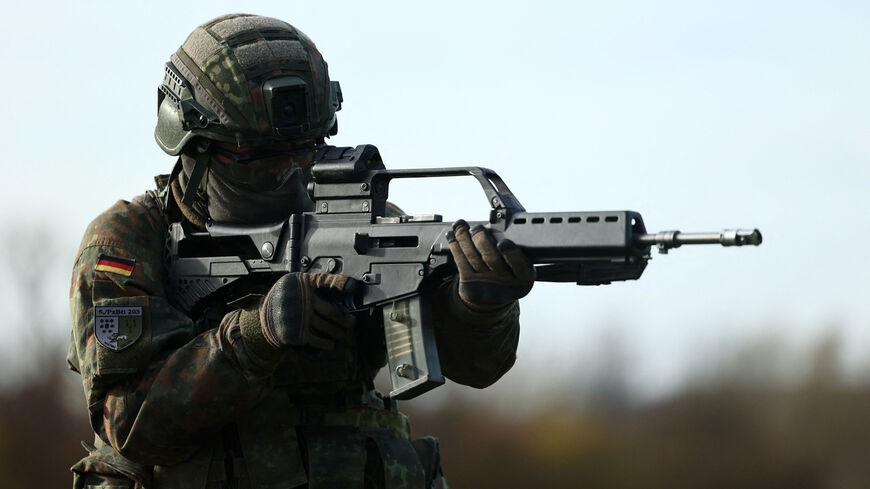 FILE PHOTO: A recruit aims his G-36 rifle amid a training drill during a media day at the Reconnaissance Battalion, as the German army showcases its new six-month basic training program designed to prepare soldiers for homeland defence and NATO operations, in Ahlen, Germany, November 13, 2025. REUTERS/Leon Kuegeler