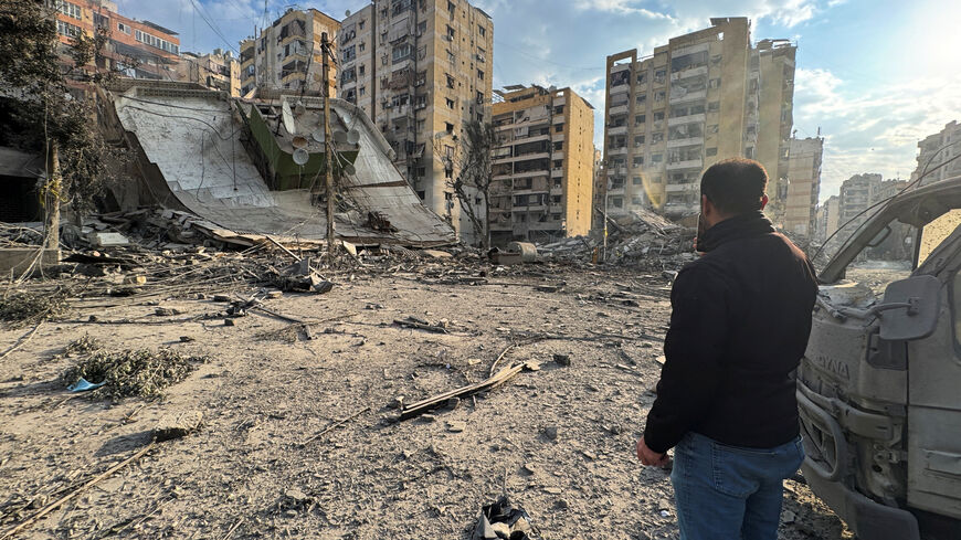 A man inspects damage buildings after an Israeli strike on Beirut's southern suburbs, following an escalation between Hezbollah and Israel amid the U.S.-Israeli conflict with Iran, Lebanon, March 7, 2026. Picture taken with a mobile phone. REUTERS/Stringer
