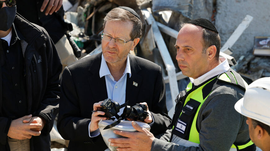Israel's President Isaac Herzog visits the site of a fatal Iranian missile strike, amid the U.S.-Israel conflict with Iran, in Beit Shemesh, Israel, March 2, 2026. REUTERS/Amir Cohen