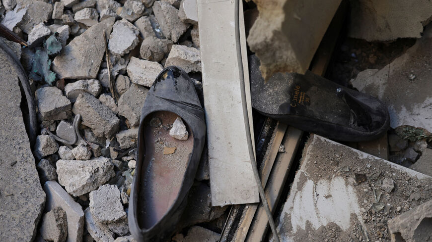 A pair of shoes lie near the site of an Israeli strike on a damaged apartment building, in central Beirut, Lebanon, March 11, 2026, following an escalation between Hezbollah and Israel amid the U.S.-Israeli conflict with Iran. REUTERS/Emilie Madi