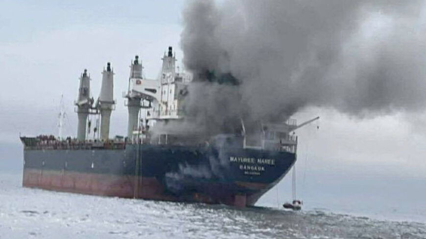 The Thailand-flagged cargo ship Mayuree Naree engulfed in black smoke in the Strait of Hormuz, March 11, 2026.  ROYAL THAI NAVY/Handout via REUTERS