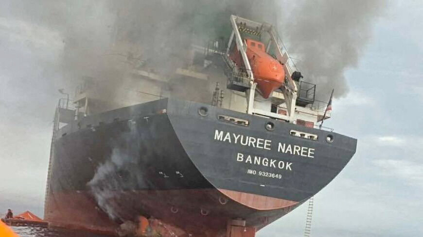 The Thailand-flagged cargo ship Mayuree Naree engulfed in black smoke in the Strait of Hormuz, March 11, 2026.  ROYAL THAI NAVY/Handout via REUTERS