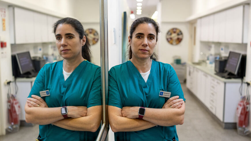 Forensic dentist Esi Sharon-Sagie, who has identified victims of Iranian missile strikes in Israel, victims of Hamas' October 7 attack, hostages and the body of Hamas leader Yahya Sinwar, poses for a photograph in her clinic during an interview with Reuters, in Jerusalem March 8, 2026. REUTERS/Ronen Zvulun