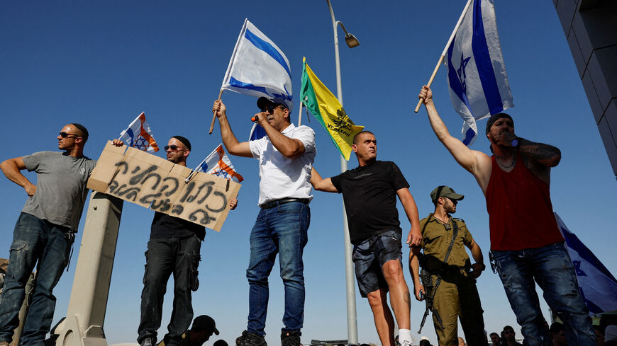 FILE PHOTO: Protesters gather outside Sde Teiman detention facility after some of them broke in, after Israeli military police arrived at the site as part of an investigation into the suspected abuse of a Palestinian detainee, near Beersheba, in southern Israel, July 29, 2024. REUTERS/Amir Cohen/File Photo