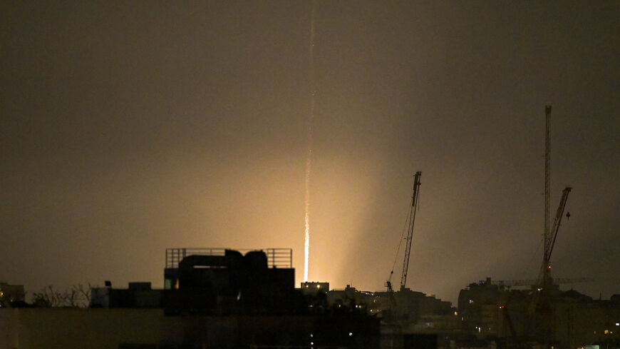 The sky is illuminated as an Iranian missile lands in Israel, amid the U.S.-Israeli conflict with Iran, as seen from Tel Aviv, Israel, March 12, 2026. REUTERS/Dylan Martinez