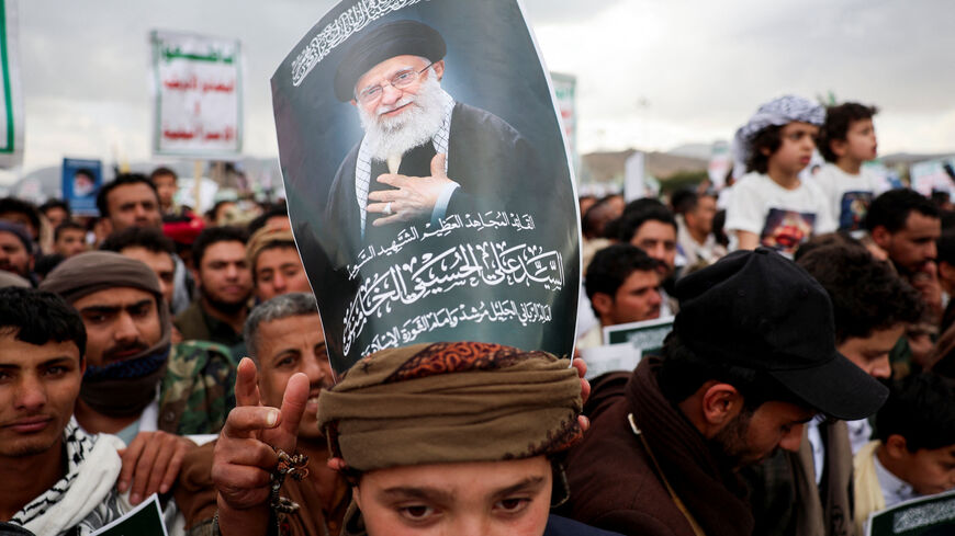 A protester with a poster on his head featuring a picture of late Iran's Supreme Leader Ayatollah Ali Khamenei joins a demonstration with Houthi supporters in solidarity with Iran and Lebanon, amid the U.S.-Israeli conflict with Iran, in Sanaa, Yemen March 6, 2026. REUTERS/Khaled Abdullah