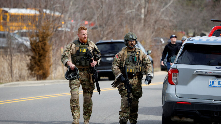 FILE PHOTO: FBI members work on the site after the Michigan State Police reported an active shooting incident at the Temple Israel Synagogue in West Bloomfield, Michigan, U.S., March 12, 2026. REUTERS/Rebecca Cook/File Photo