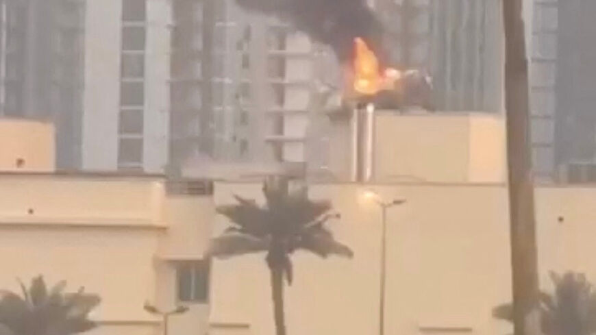 Smoke rises from the U.S. embassy building, after Iraqi security sources said the embassy was hit in a missile attack, in Baghdad, Iraq March 14, 2026 in this screen grab obtained from a social media video. SOCIAL MEDIA/via REUTERS