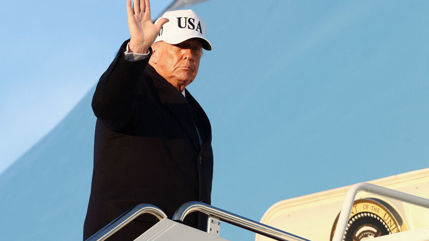 U.S. President Donald Trump waves as he boards Air Force One for travel to Florida, at Joint Base Andrews, Maryland, U.S., March 13, 2026. REUTERS/Kevin Lamarque