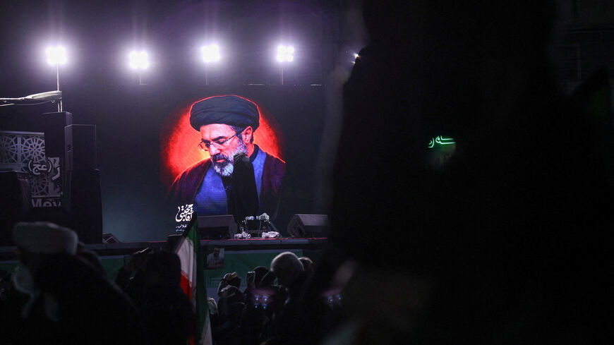 A picture of Iran's new supreme leader Mojtaba Khamenei is displayed on a screen in Tehran, March 9.  Majid Asgaripour/WANA
