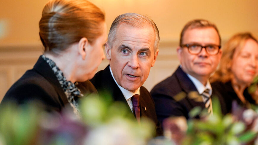 Canadian Prime Minister Mark Carney speaks with Danish Prime Minister Mette Frederiksen at the government's representative facility in Oslo, Norway, March 15, 2026. NTB/Thomas Fure via REUTERS