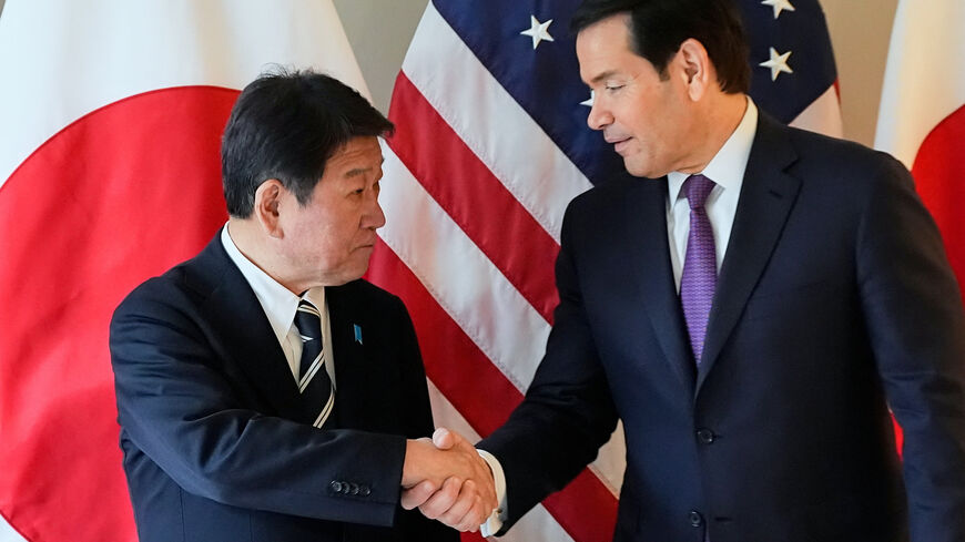 FILE PHOTO: U.S. Secretary of State Marco Rubio shakes hands with Japan's Foreign Minister Toshimitsu Motegi on the sidelines of the Munich Security Conference in Munich, Germany, February 14, 2026.  Alex Brandon/Pool via REUTERS/File Photo