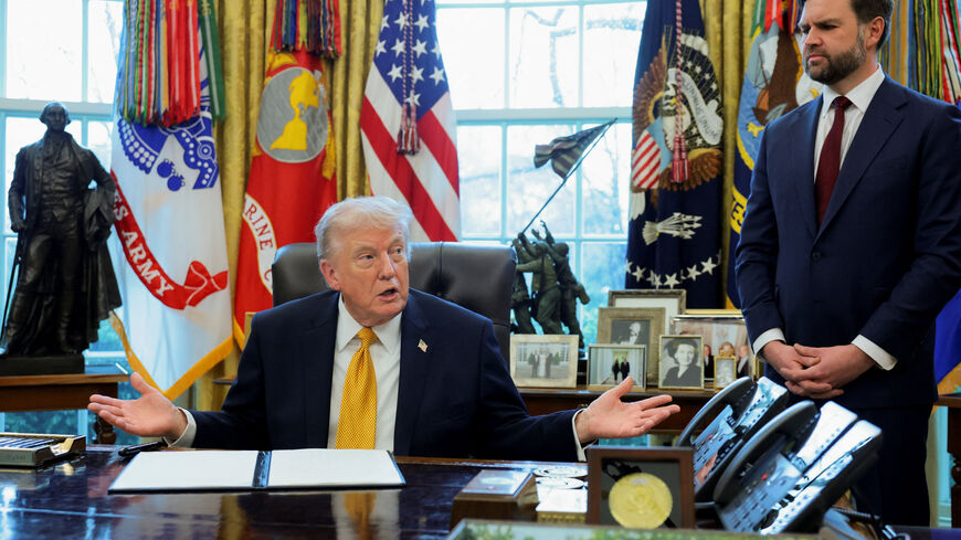 U.S. President Donald Trump, next to U.S. Vice President JD Vance, speaks during an event to sign an executive order creating an anti‑fraud task force headed by Vance, in the Oval Office at the White House in Washington, D.C., U.S., March 16, 2026. REUTERS/Jonathan Ernst