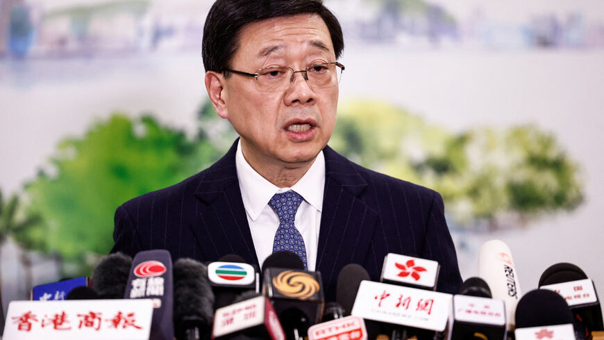 Chief Executive of Hong Kong John Lee speaks during a press conference in Beijing, China December 16, 2025. REUTERS/Tingshu Wang
