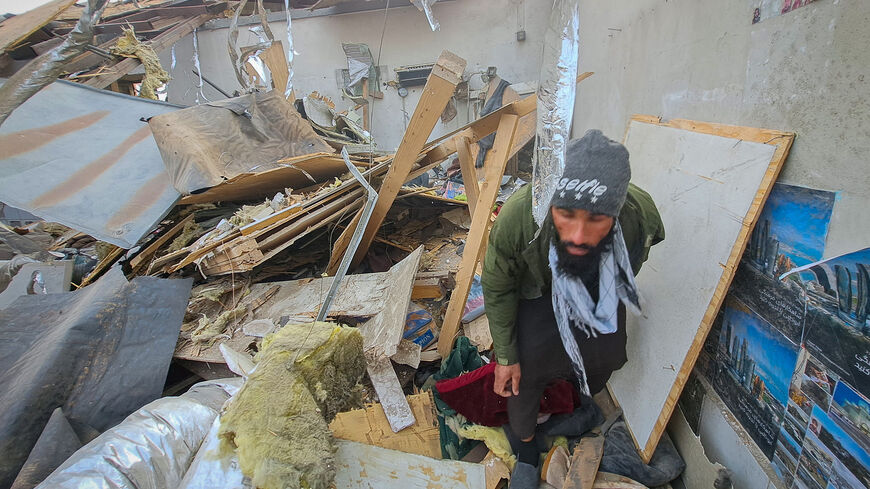 A man walks through debris lying in a ward of a drug users rehabilitation hospital destroyed in what the Taliban said was a Pakistani air strike in Kabul, Afghanistan, March 17, 2026. REUTERS/Yunus Yawar