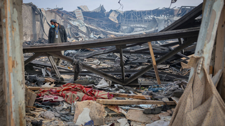 A man walks through debris at the site of a drug users rehabilitation hospital destroyed in what the Taliban said was a Pakistani air strike in Kabul, Afghanistan, March 17, 2026. REUTERS/Sayed Hassib