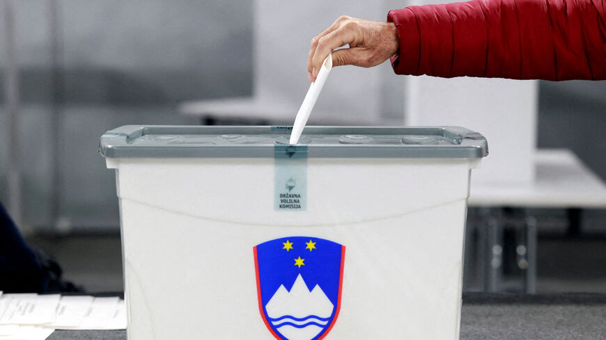 A person votes during the early voting ahead of national elections, in Ljubljana, Slovenia. REUTERS/Borut Zivulovic