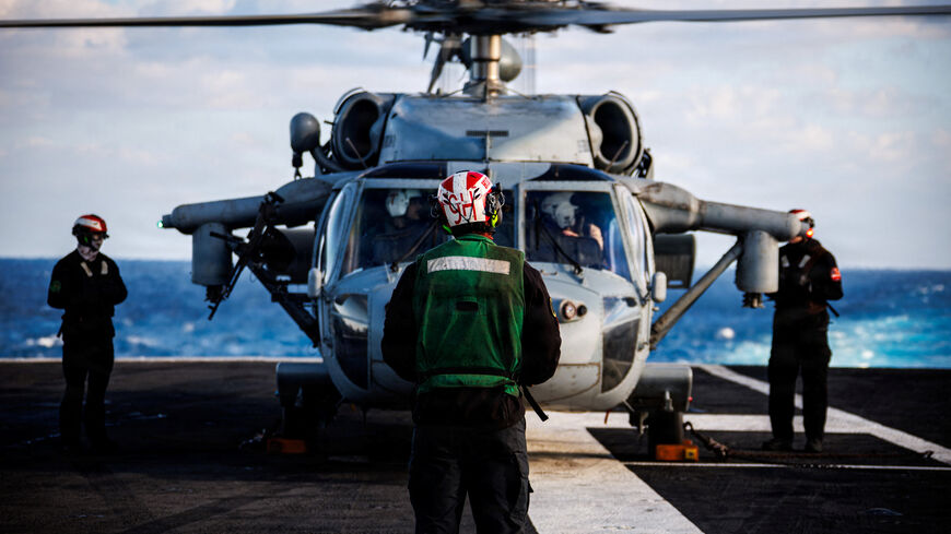 A U.S. Navy sailor prepares an MH-60S Sea Hawk helicopter for launch on the flight deck of the aircraft carrier USS Gerald R. Ford, while operating in support of the Operation Epic Fury attack on Iran from an undisclosed location, February 28, 2026. U.S. Navy/Handout via REUTERS