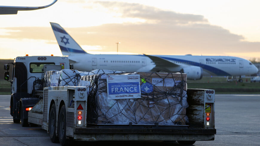 Worldwide Flight Services (WFS) personnel prepare humanitarian aid packages for the first French humanitarian flight to Beirut, carrying 60 tonnes of relief supplies and pharmaceutical products, at Paris‑Charles de Gaulle Airport, in Roissy‑en‑France near Paris, France, March 12, 2026. REUTERS/Gonzalo Fuentes