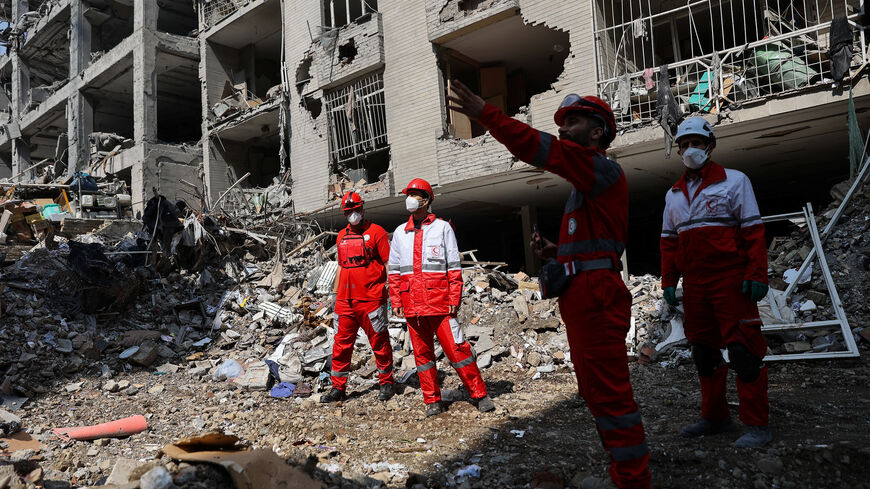 Members of a Red Crescent rescue team work at a building that was damaged by a strike, amid the U.S.-Israeli conflict with Iran, in Tehran, Iran, March 17, 2026. Majid Asgaripour/WANA (West Asia News Agency) via REUTERS