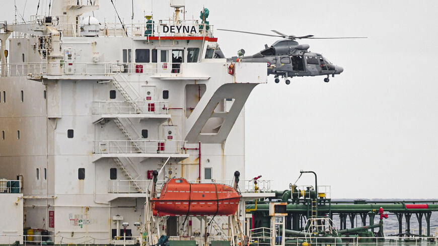 A French Navy helicopter hovers over the Deyna vessel, which is supposed to be a member of the Russian shadow fleet, during an operation  in the Western Mediterranean Sea, in this handout image obtained by Reuters on March 20, 2026. Prefecture maritime de la Mediterranee/Etat Major des Armees/Handout via REUTERS