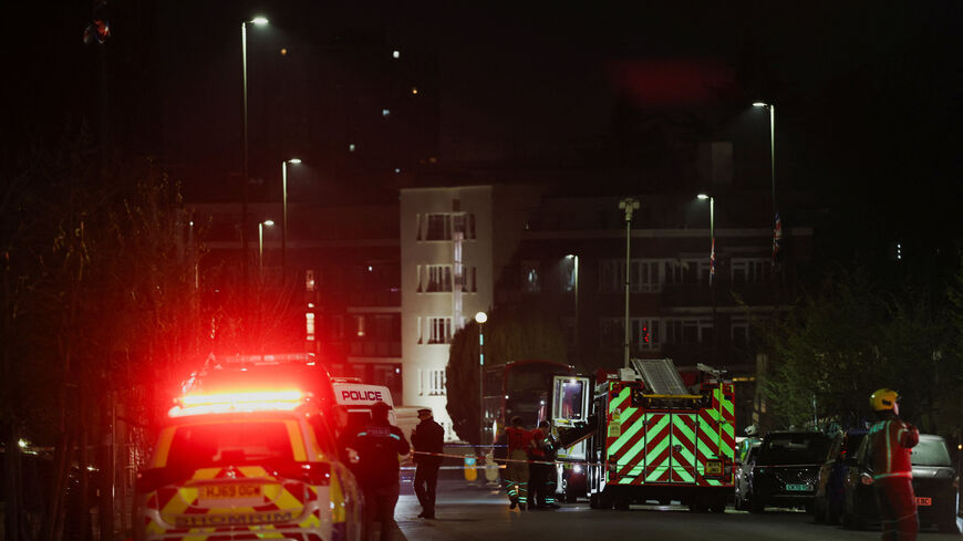 Emergency personnel work near the scene after four ambulances belonging to Hatzola, a Jewish community organisation, were set on fire in an incident that the police say is being treated as an antisemitic hate crime, in northwest London, Britain, March 23, 2026. REUTERS/Isabel Infantes