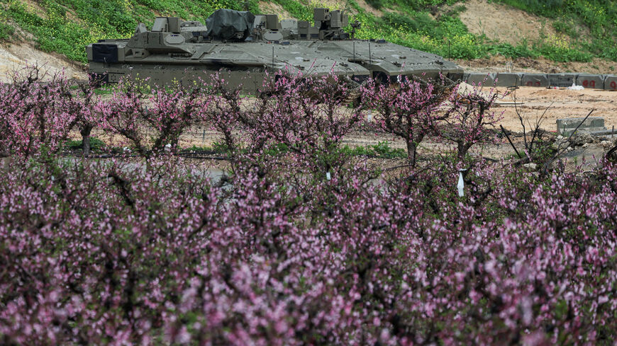 Israeli military vehicles are parked on the Israeli side of the border with Lebanon, amid escalation between Iran-backed Hezbollah and Israel and the U.S.-Israeli conflict with Iran, in northern Israel, March 21, 2026. REUTERS/Tyrone Siu