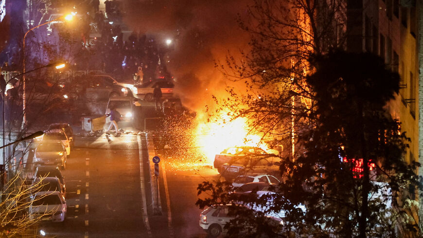 FILE PHOTO: Cars burn in a street during a protest over the collapse of the currency's value, in Tehran, Iran, January 8, 2026. Stringer/WANA (West Asia News Agency) via REUTERS/File Photo