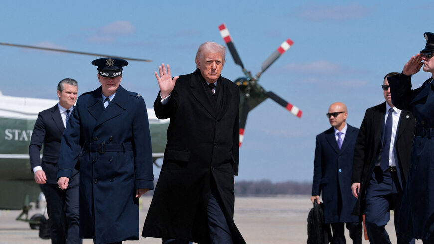 FILE PHOTO: U.S. President Donald Trump gestures as he boards Air Force One to travel to Dover Air Force Base, as he departs from Joint Base Andrews, Maryland, U.S., March 18, 2026. REUTERS/Kylie Cooper/File Photo