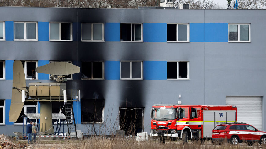 A firetruck stands in front of a burned production hall at an industrial area in Pardubice, Czech Republic, March 20, 2026. REUTERS/David W Cerny