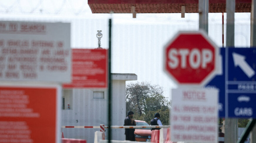 FILE PHOTO: People at RAF Akrotiri, a British sovereign base that was hit by a drone early on Monday, causing limited damage, after sirens sounded, in Cyprus, March 6, 2026. REUTERS/Yiannis Kourtoglou/File Photo