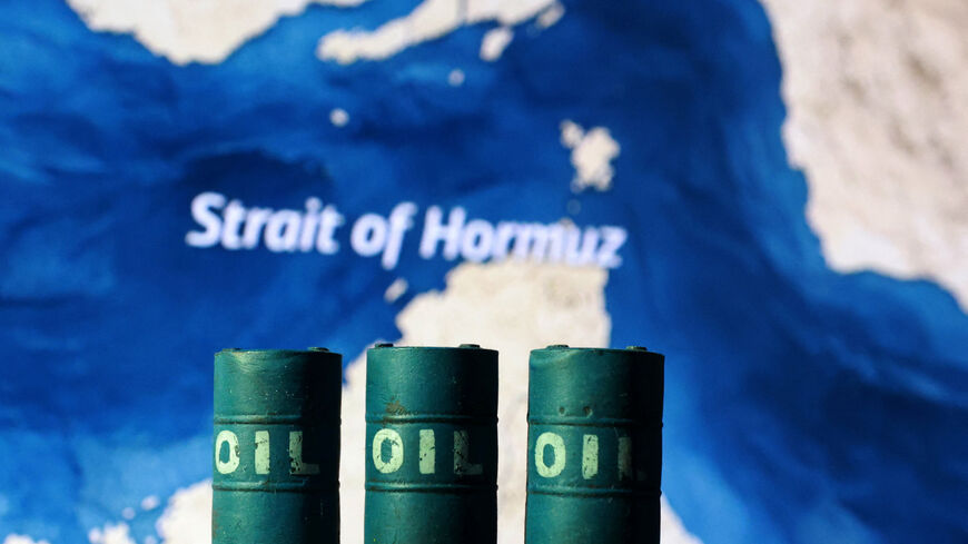 A map showing the Strait of Hormuz and 3D printed oil barrels are seen in this illustration taken March 23, 2026. REUTERS/Dado Ruvic/Illustration