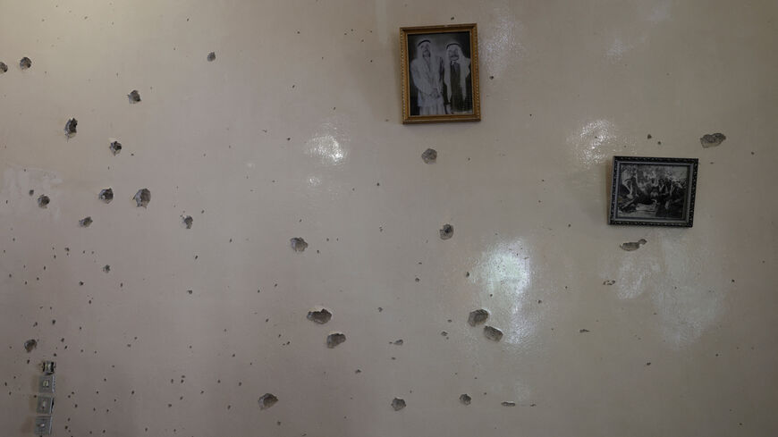 FILE PHOTO: A wall is pockmarked by bullet holes inside the Saraya family house, following sectarian violence in Syria's Sweida province, where government forces were sent to quell local clashes between Druze armed factions and Bedouin tribal fighters, in the predominantly Druze city of Sweida, Syria, July 25, 2025. REUTERS/Khalil Ashawi/File Photo
