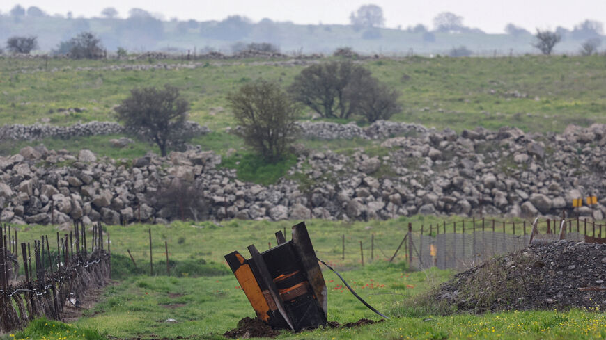 FILE PHOTO: The tail fin of a large missile protrudes from a field, following barrages of missiles from Iran towards Israel, amid the U.S.-Israel conflict with Iran, in the Israeli-occupied Golan Heights March 19, 2026. REUTERS/Tyrone Siu/File Photo