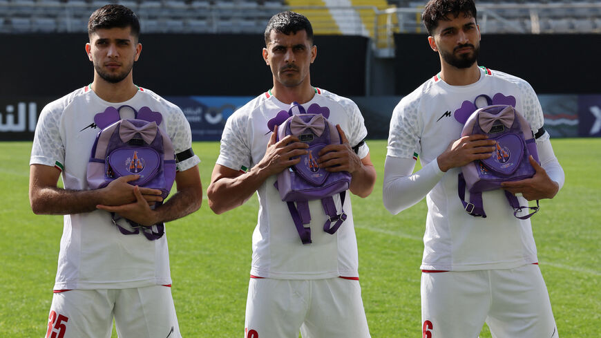 Soccer Football - International Friendly - Iran v Nigeria - Mardan Sports Complex, Antalya, Turkey - March 27, 2026  Iran's Aria Yousefi, Ali Nemati and Mohammad Ghorbani hold school bags in memory of the victims of the girls school bombing in Minab, Iran REUTERS/Umit Bektas