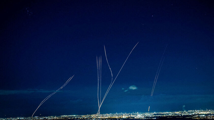 Interceptors rise into the sky after Iran launched missiles into Israel, as seen from central Israel, February 28.   REUTERS/Oren Ben Hakoon