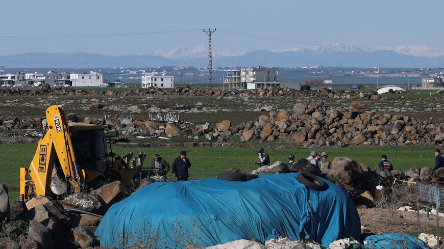 FILE PHOTO: Turkish army personnel search a field after a piece of ammunition fell following the interception of a missile launched from Iran by a NATO air defence system, in Diyarbakir, Turkey, March 9, 2026. REUTERS/Sertac Kayar/File Photo