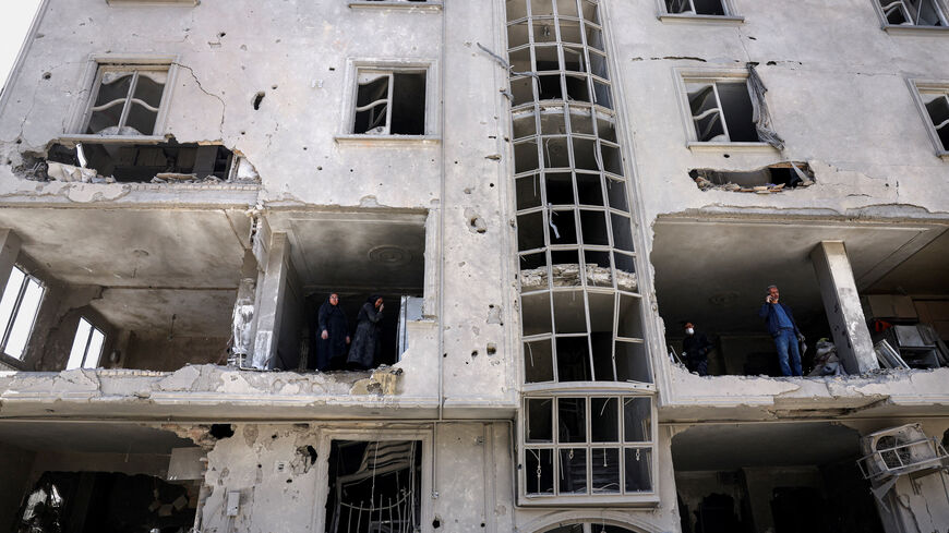 People inspect damage to a residential building after it was hit by a strike, amid the U.S.-Israeli conflict with Iran, in Tehran, Iran, March 30, 2026. Majid Asgaripour/WANA (West Asia News Agency) via REUTERS