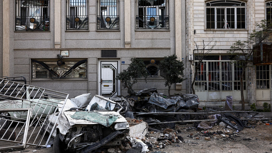 Car wrecks and a residential building damaged by a strike amid the U.S.-Israeli conflict with Iran, in Tehran, Iran, March 30, 2026. Majid Asgaripour/WANA (West Asia News Agency) via REUTERS