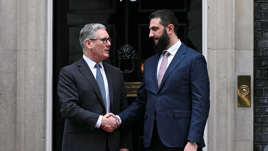 Syria's President Ahmed al-Sharaa is welcomed by Britain's Prime Minister Keir Starmer ahead of their meeting at 10 Downing Street in central London, Britain, March 31, 2026.     JUSTIN TALLIS/Pool via REUTERS