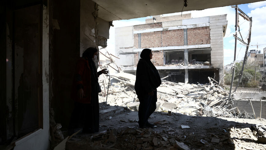 A woman stands in her brother's home, which was damaged by a strike, as the U.S.-Israeli conflict with Iran continues, in Tehran, Iran, March 30, 2026. Majid Asgaripour/WANA (West Asia News Agency) via REUTERS