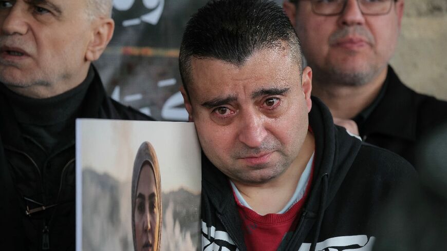 Mourners at the funeral in Beirut of the three journalists killed in an Israeli strike