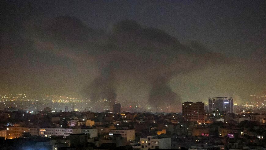 Plumes of smoke rise following reported explosions in Tehran early on March 3, 2026