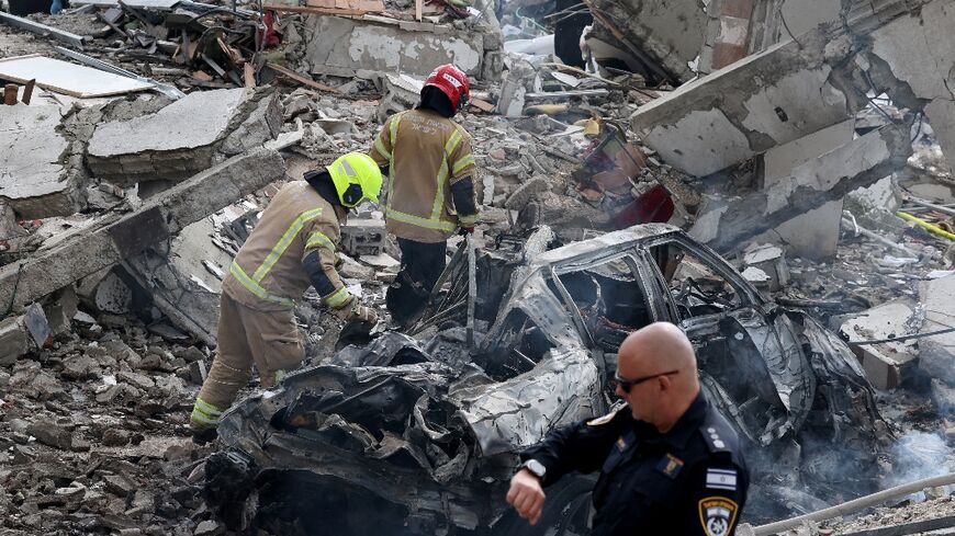 Israeli rescue teams still search for missing people after a deadly Iranian missile strike 