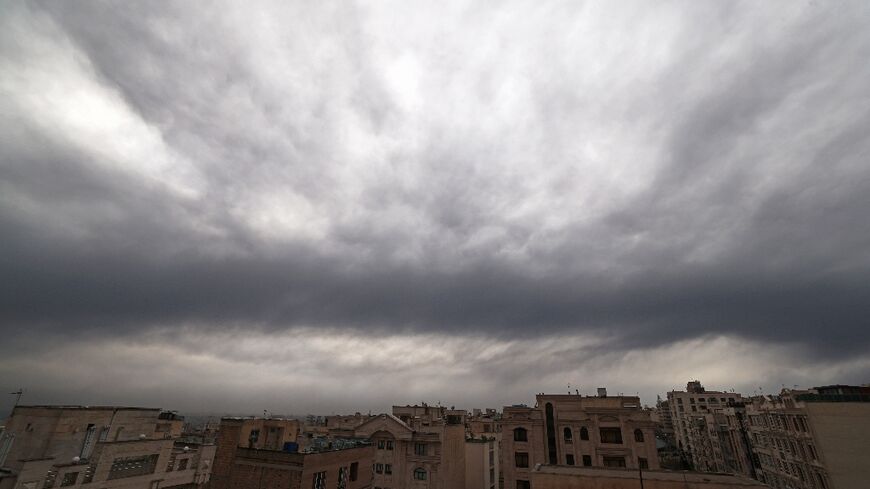 Cloud and smoke lay heavy over Tehran on Sunday after overnight US-Israeli strikes on fuel depots