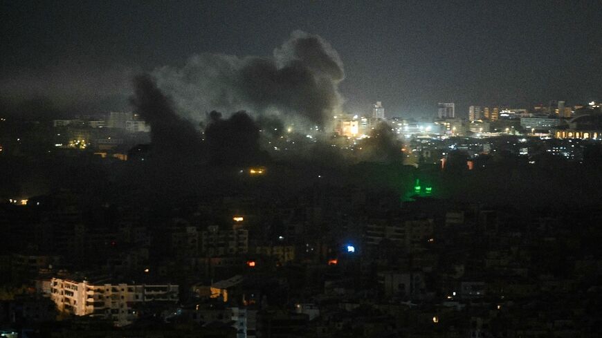 A plume of smoke rises from the site of an Israeli airstrike in the southern suburbs of Beirut early on March 12
