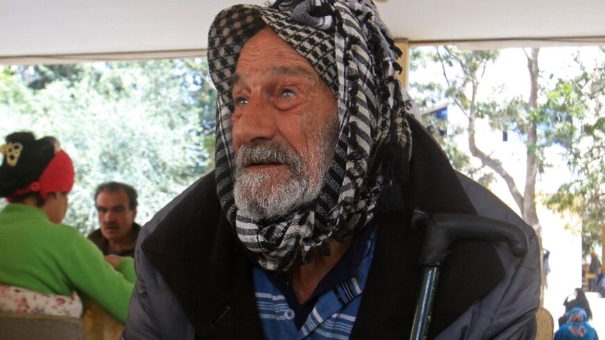 A man from southern Lebanon takes shelter at a school in Sidon