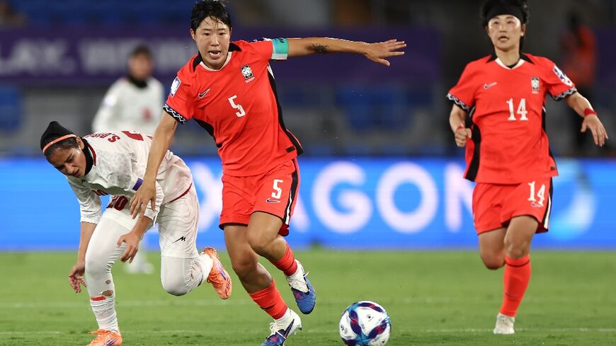 Ko Yoo-jin (C) scored the final goal in South Korea's 3-0 victory over Iran in their first match of the Women's Asian Cup